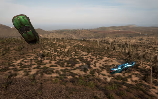 Green sports car and blue sports car flying over desert landscape.