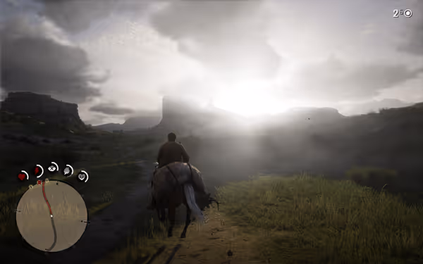 A man rides a horse through a misty valley at sunrise.