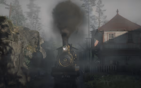 A steam engine emerges from the fog, passing a rustic station near rocky cliffs and dense trees.