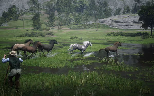 A male character watches horses gallop through the water in a lush green field.