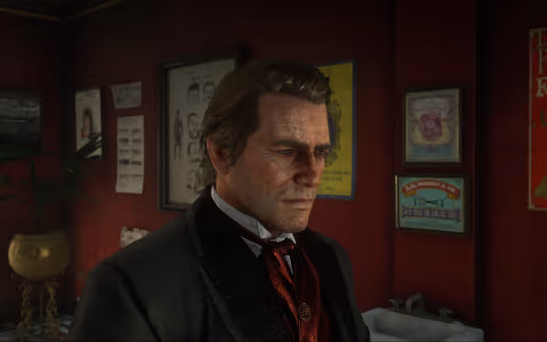 A character with a neutral expression, wearing a black suit and red tie, stands inside a dimly lit room with walls adorned with posters.