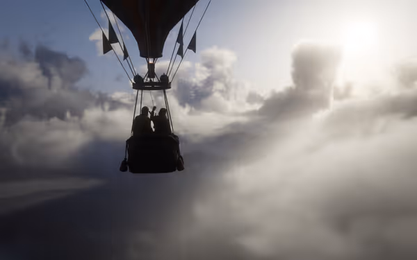 Hot air balloon with two people flying in a cloudy sky.