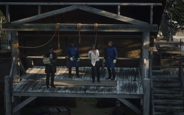 A wooden gallows with ropes, four men, and a staircase in an outdoor setting.