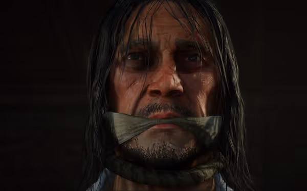 A person with long hair, mouth tied, and rope under neck in a dark room