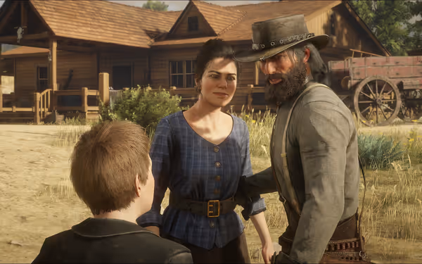 Three people stand outside a wooden house with a wagon in the background.