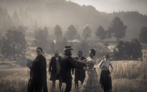 A group of people stands in a field, two central figures shaking hands.