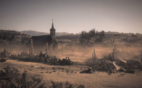 A small church stands in a dusty desert landscape surrounded by cacti.