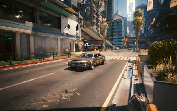 A rugged black car with a reinforced front grille drives through a futuristic urban street.