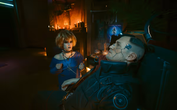 A woman with short blonde hair and a choker faces a cybernetic man reclining.