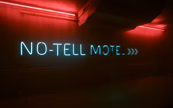 A neon sign reads "NO-TELL MOTEL >>>" on a dimly lit wall with red lighting