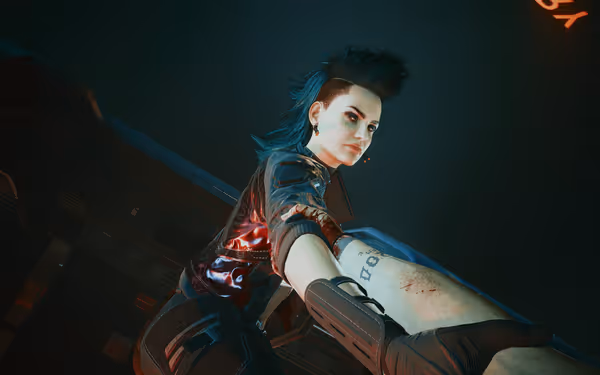 A fierce-looking woman with a mohawk grips an injured arm inside a futuristic setting