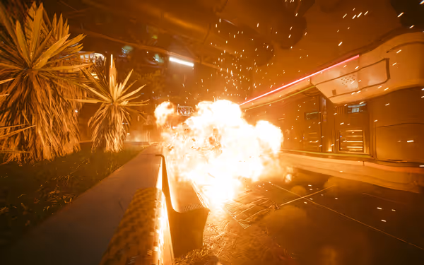 A fiery explosion engulfs two figures near a futuristic bench and neon-lit building.