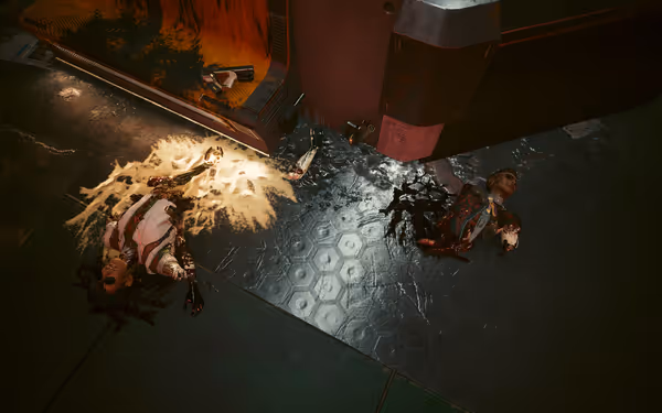 Two heavily mutilated bodies lie on a metallic floor, with blood and synthetic fluids.