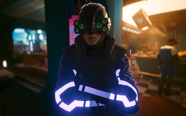A futuristic armored figure with glowing sleeves and multi-lens goggles stands confidently indoors