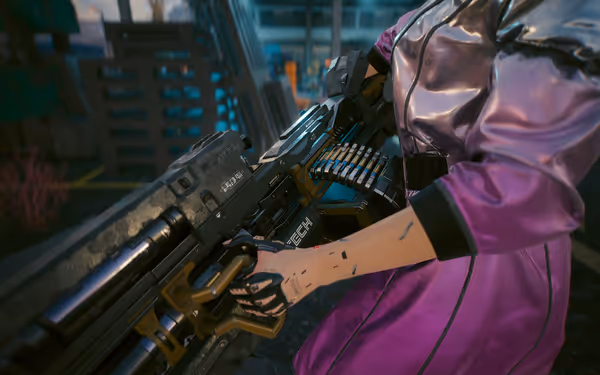 A cybernetic hand grips a futuristic MIlitech heavy machine gun with an ammo belt.