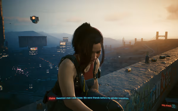 A woman with dark hair sits on a ledge at sunset, looking sad.