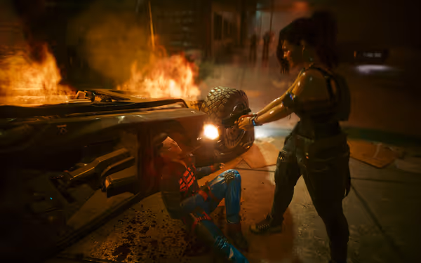 A woman aims a gun at a wounded man near a burning overturned vehicle