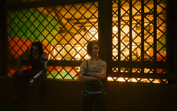 Two characters stand and sit by a barred window, one with cybernetic arm and sunglasses.