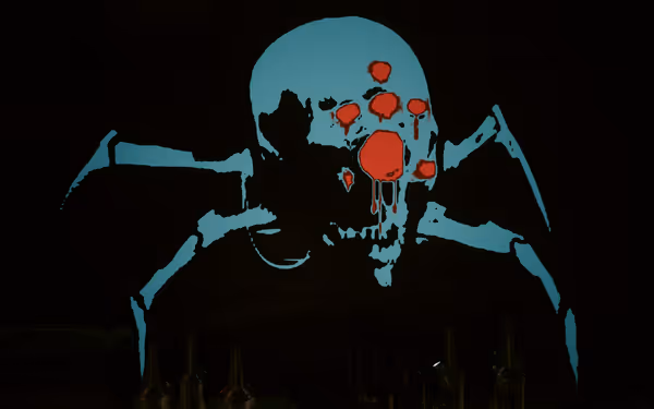 A blue skull with spider legs has red bullet-like holes dripping down its face.