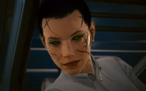 Close-up of woman with green cybernetic eyes, facial tattoos, and freckles on train.