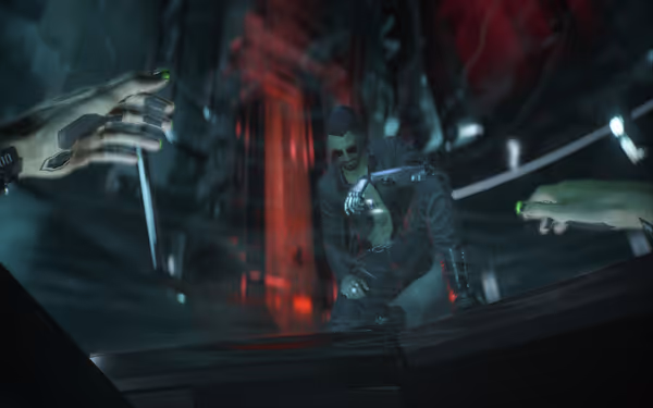 A man with cybernetic arm kneels under red lights as two hands reach out.