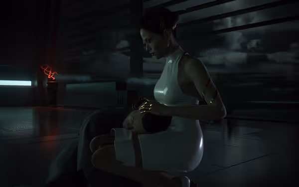 A woman in a white dress cradles a man's head gently on her lap.