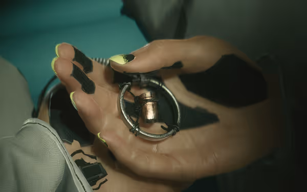 A cybernetic hand holds a necklace with a single copper bullet pendant.
