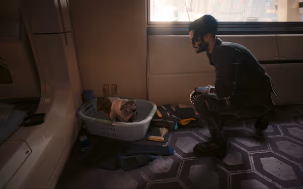 A man with a cybernetic arm squats beside a hairless cat in a basket.