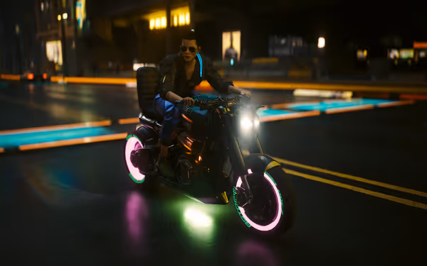 A rider with sunglasses drives a black neon-lit motorcycle through a futuristic city street.