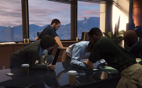 Several people in an office lean over a table during a tense discussion.