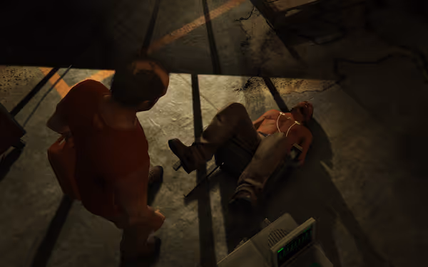 A shirtless man lies on the ground hooked to a monitor while another man stands above him.