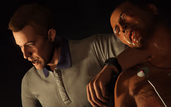 A serious man leans over an injured, shirtless man with blood on his mouth.