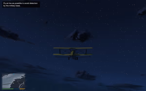A small yellow biplane flies under a starry night sky above distant mountains.