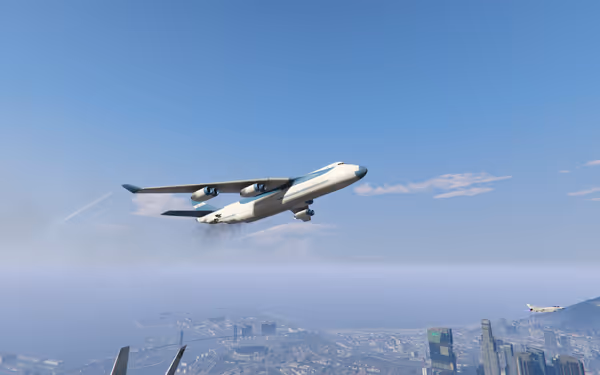 A large cargo plane flies above a city skyline with smaller jets nearby.