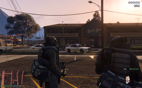 Two people in tactical gear hold weapons near police cars during daylight hours.