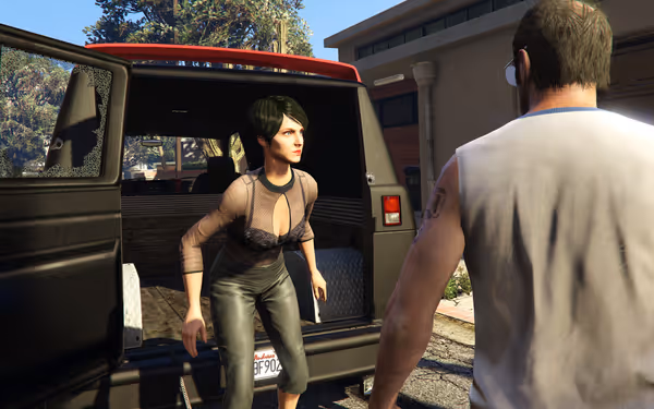 A woman climbs out of a van’s rear as a man faces her.