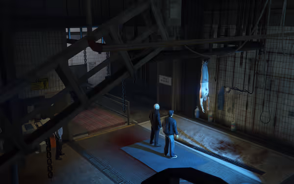 Two men stand in a slaughterhouse room, facing a person hanging upside down.