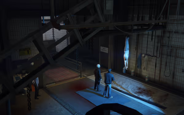 A man hangs upside down under a spotlight while two masked figures stand beneath him.