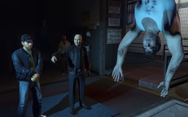 Three men are in a dimly lit room, with one man hanging upside down, injured.