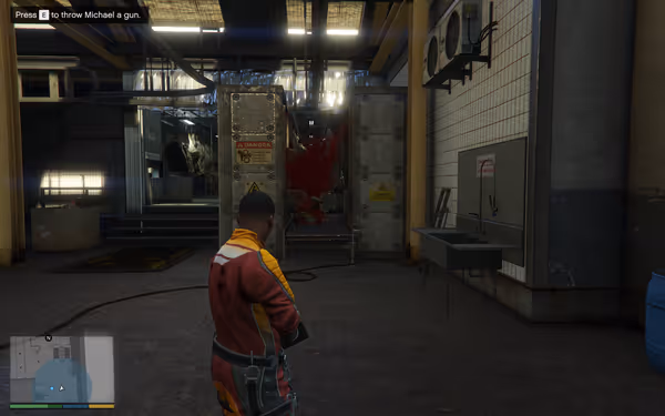 A man in a red jumpsuit stands in an industrial facility with warning signs.