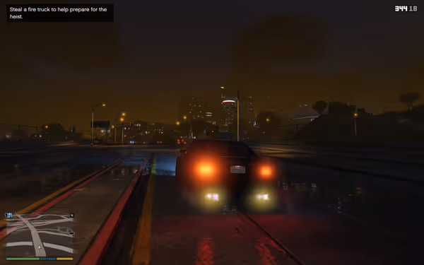 A black car with bright taillights drives on a wet city road at night.