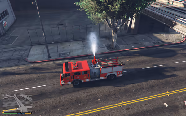 A red fire truck labeled "32" sprays water from its roof cannon on a street.