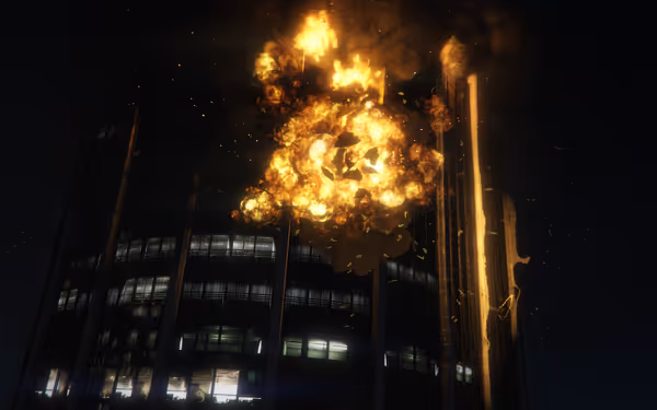 A fiery explosion erupts from the top floors of a multi-story office building.