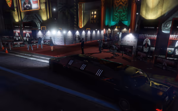 A black limousine is parked by a red carpet event with photographers and guests outside.