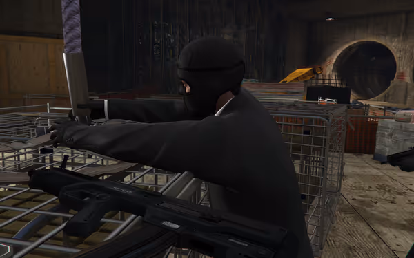 A masked person in dark clothing grips a metal pole in a dimly lit industrial setting