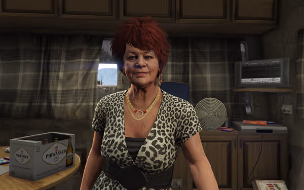 An older woman with red hair and leopard print dress stands inside a cluttered room.