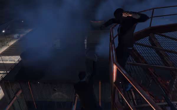 Two men struggle on a metal catwalk at night surrounded by blue smoke and tanks.