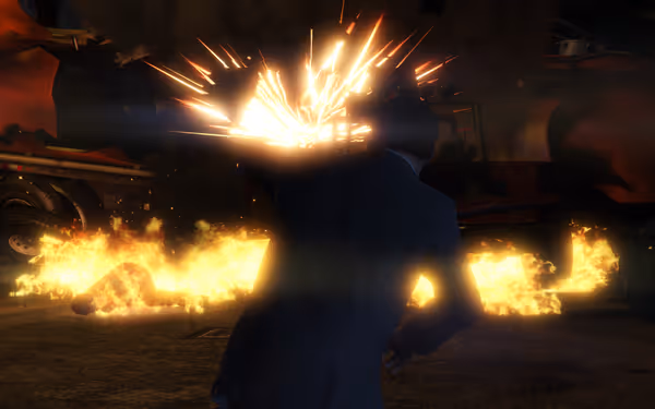 A person in a suit flees from an explosion and fire, as another lies on the ground.