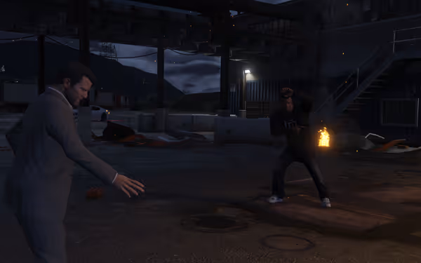 Two men confront each other outdoors at night, with fire visible behind them.