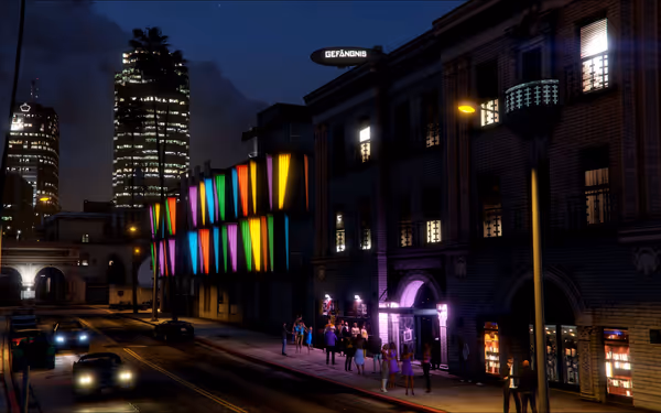 A lively street at night with colorful neon lights and people outside a building.